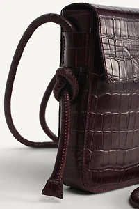 LIMITED EDITION EMBOSSED LEATHER CROSSBODY BAG