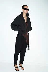 PLEATED PANTS WITH CUFFED HEM