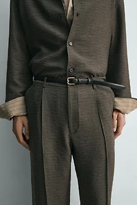 FLOWY TEXTURED PLEATED PANTS
