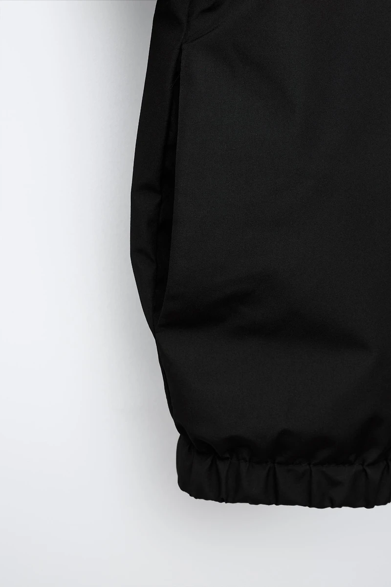 WATER REPELLENT TECHNICAL RAINCOAT
