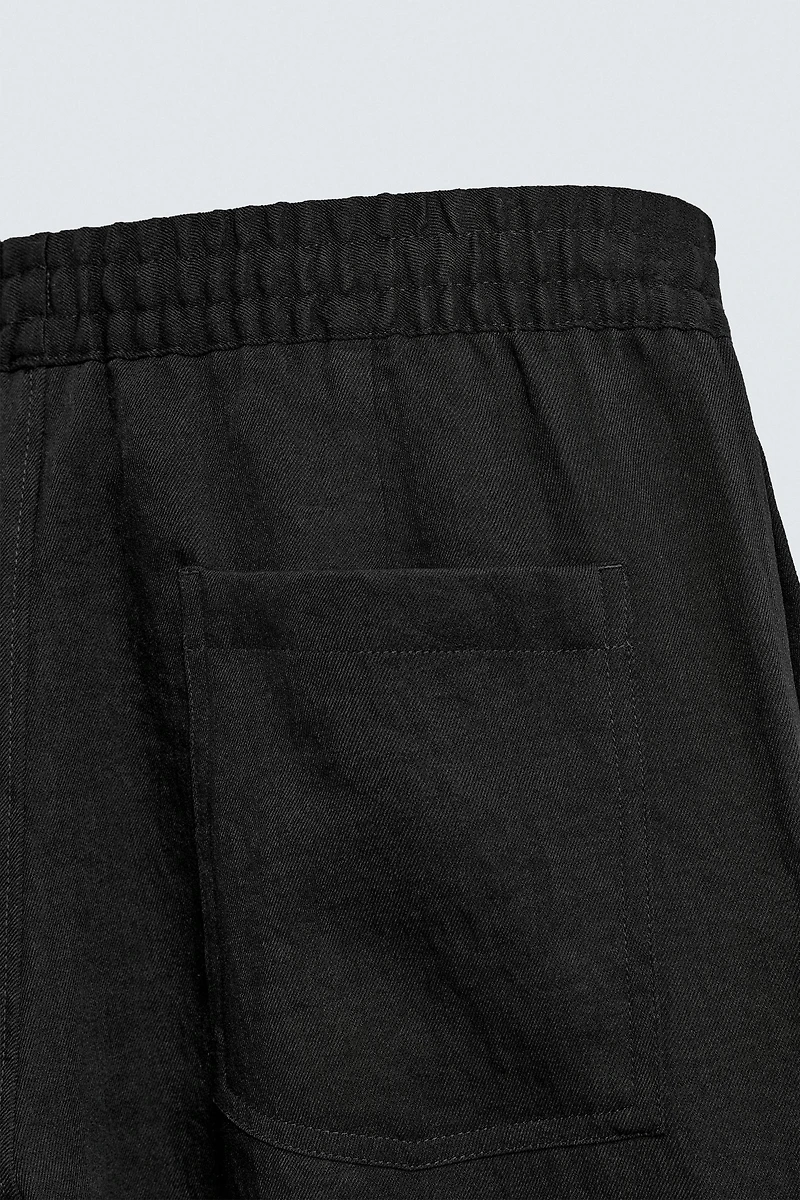 FLOWY PLEATED PANTS