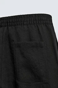 FLOWY PLEATED PANTS