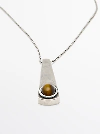 Geometric pendant with stone