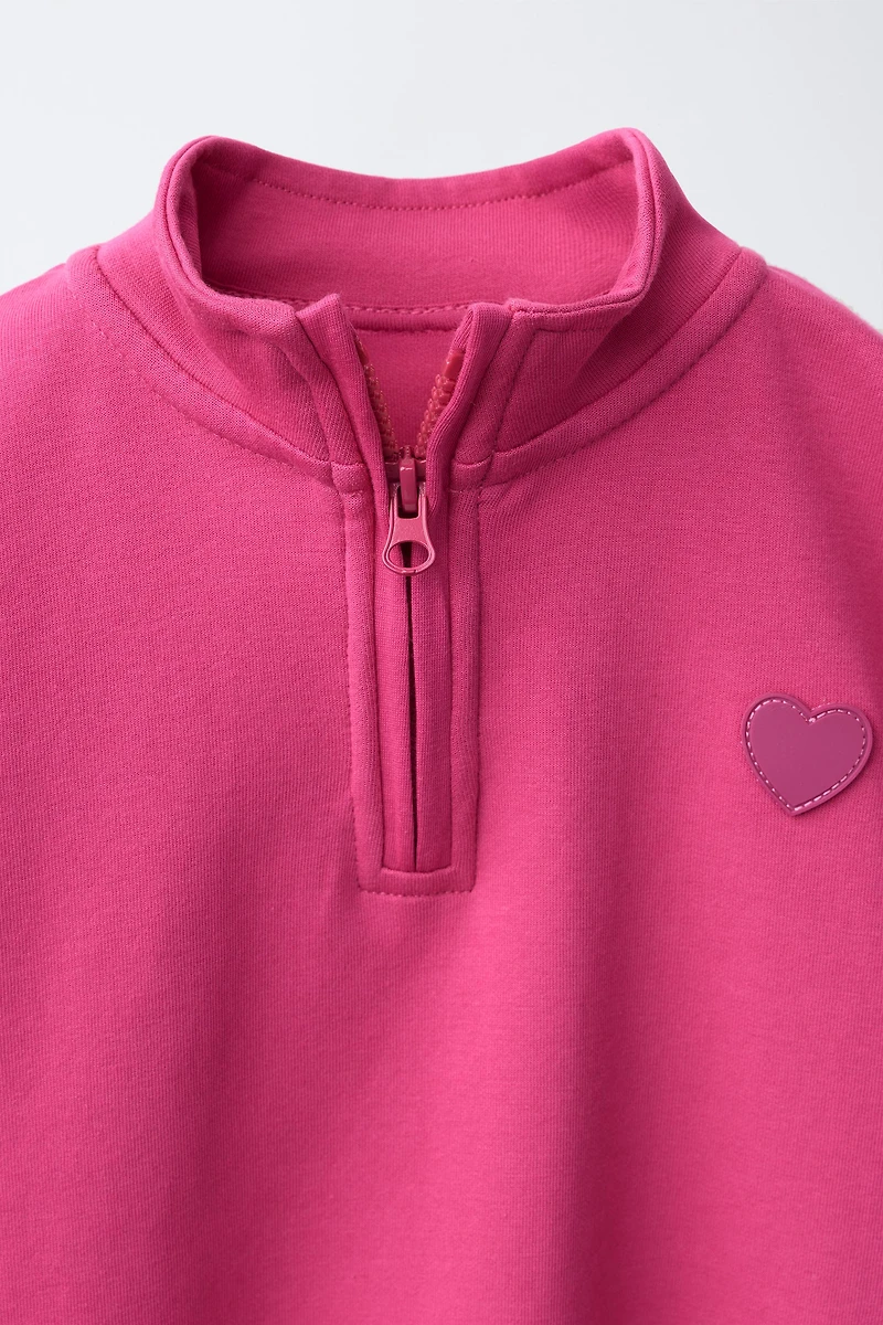 RUBBERIZED HEART INTERLOCK SWEATSHIRT