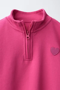 RUBBERIZED HEART INTERLOCK SWEATSHIRT