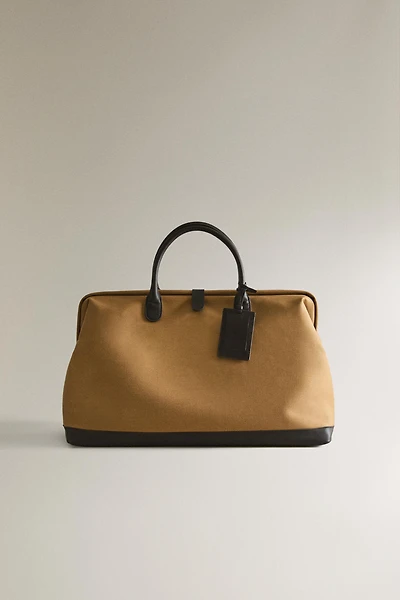 COTTON TRAVEL BAG WITH BUTTON CLOSURE