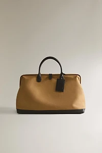 COTTON TRAVEL BAG WITH BUTTON CLOSURE