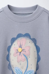 SWEAT IMPRIMÉ FLEURS ET DÉTAIL CROCHET