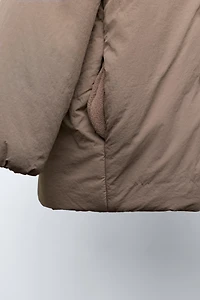 WATER REPELLENT PUFFER COAT WITH BOWS