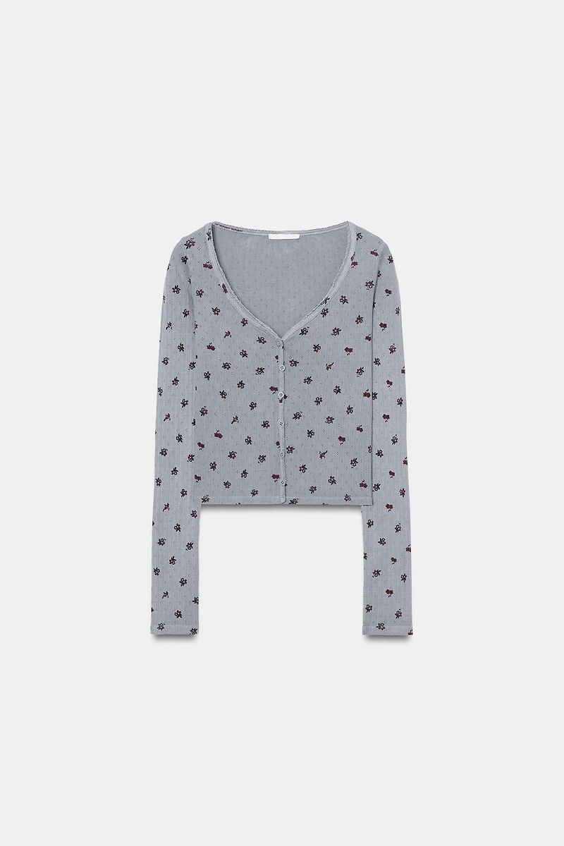 VESTE POINTELLE À FLEURS