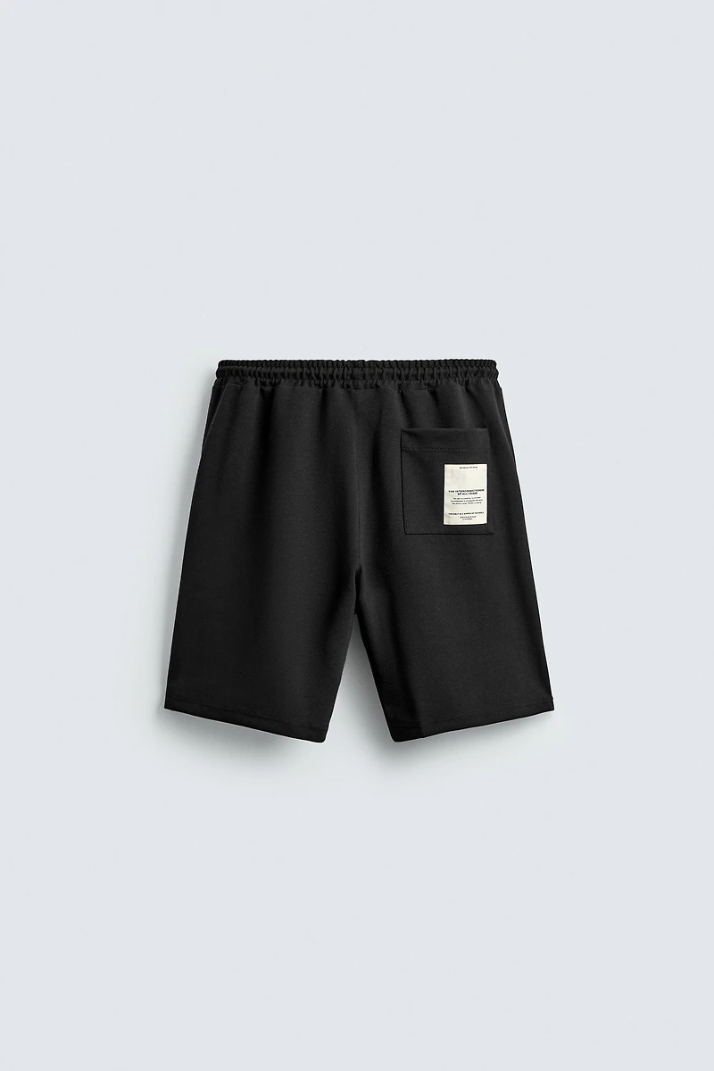 BERMUDA INTERLOCK ÉTIQUETTE