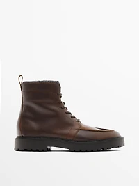 Lace-up leather boots with lined interior