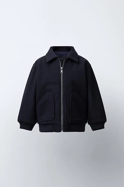VESTE EN LAINE À POCHES