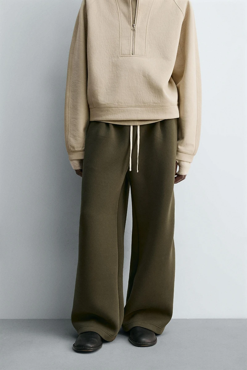 WIDE FIT NEOPRENE EFFECT PANTS WITH STUDS