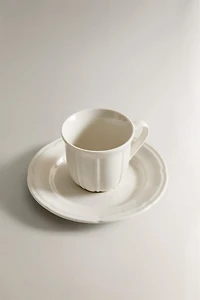 COFFEE CUP AND PORCELAIN SAUCER WITH RAISED DESIGN