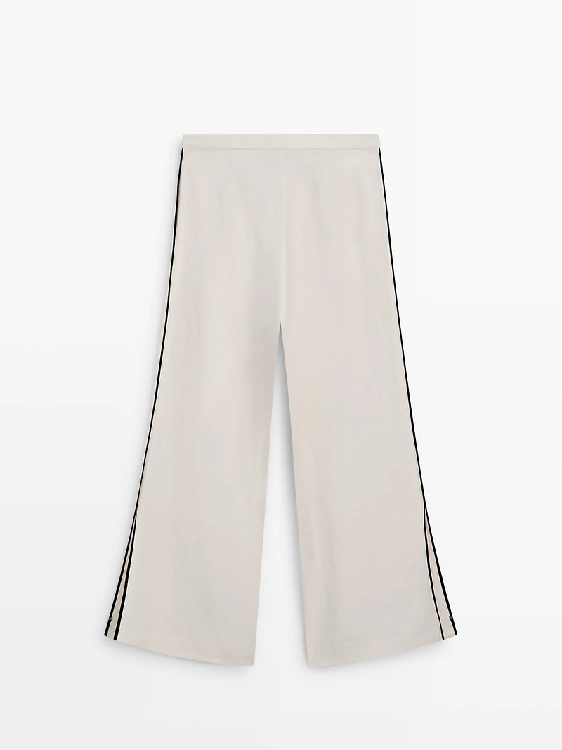 Linen trousers with contrast piping