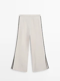 Linen trousers with contrast piping
