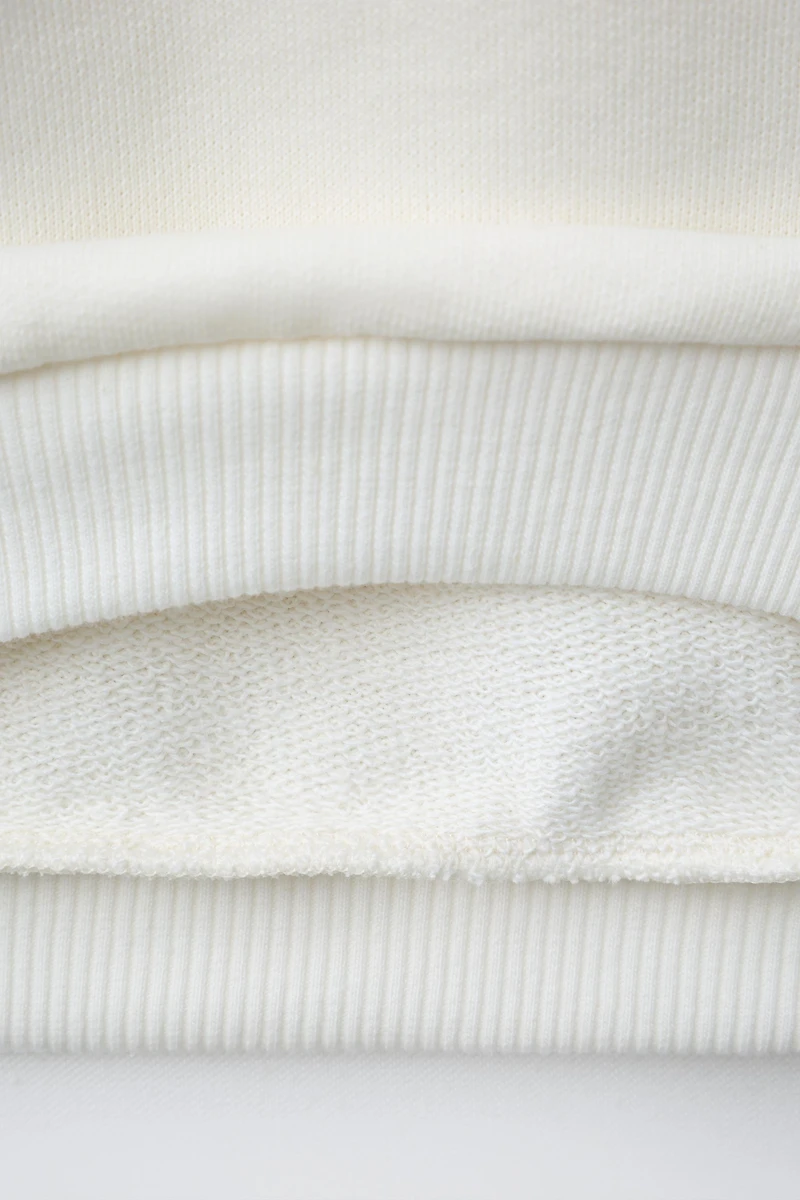 STRIPED HEART PATCH SWEATSHIRT