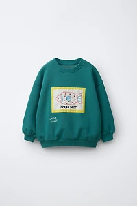 EMBROIDERED PATCH SWEATSHIRT