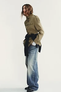 VESTE À POCHES ET PATTES