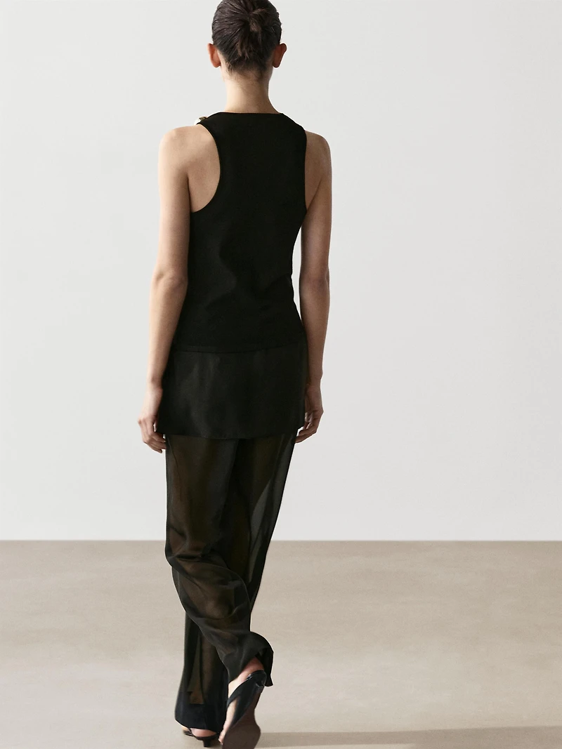 Draped neckline top with brooch detail