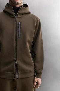 SWEAT TECHNIQUE ZIPPÉ À CAPUCHE