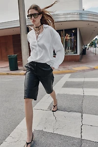 FAUX LEATHER LONG SHORTS