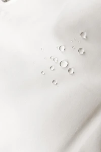 WATER RESISTANT AND WINDPROOF RECCO® SYSTEM SKI COLLECTION LONG JUMPSUIT WITH FAUX FUR HOODIE