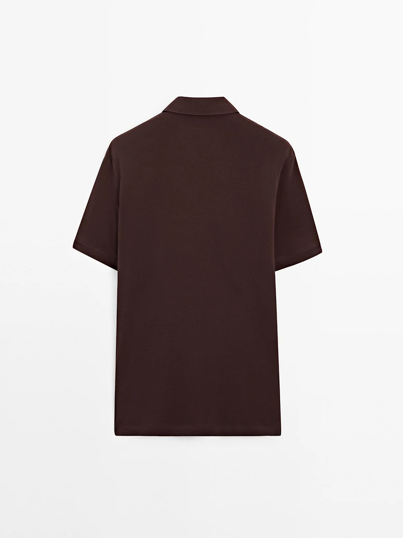 Short sleeve polo shirt with snap-button placket