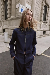 VESTE AVEC SURPIQÛRES À CONTRASTE