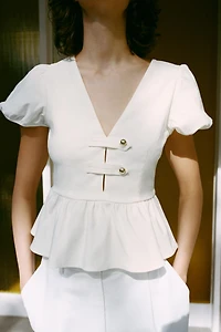 HIGH-WAISTED PLEATED SHORTS