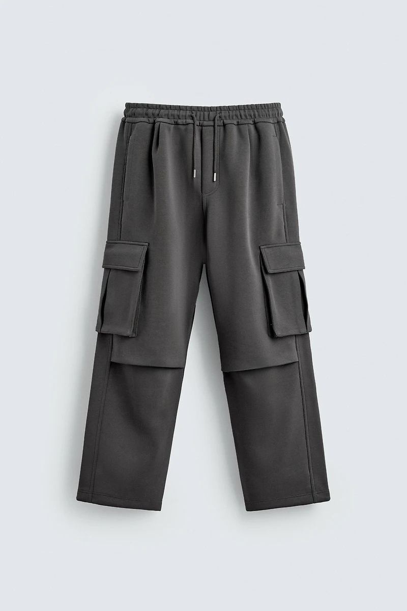 NEOPRENE EFFECT CARGO PANTS WITH PLEATS