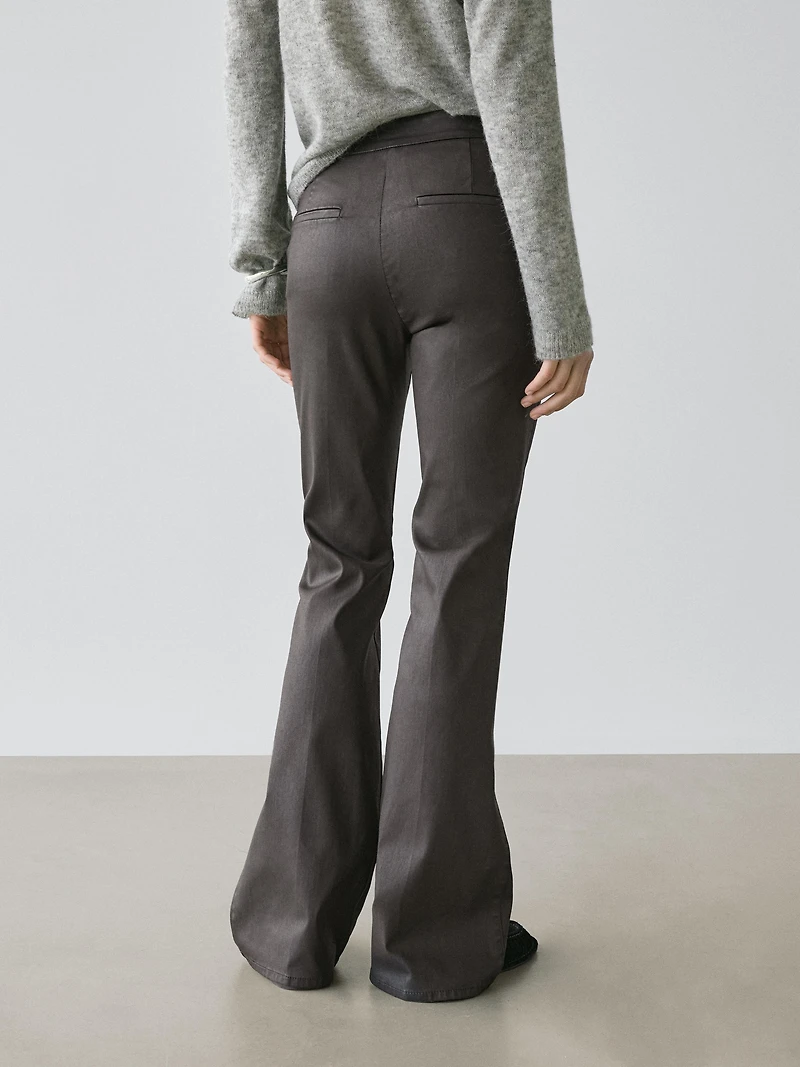 Waxed flare fit trousers