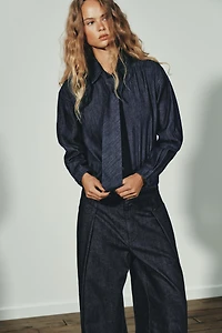 PLEATED FAUX DENIM PANTS