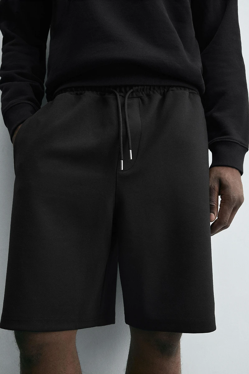 BERMUDA INTERLOCK ÉTIQUETTE