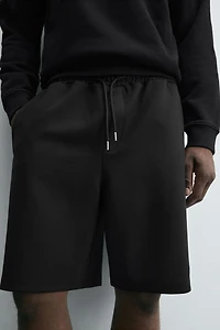 BERMUDA INTERLOCK ÉTIQUETTE