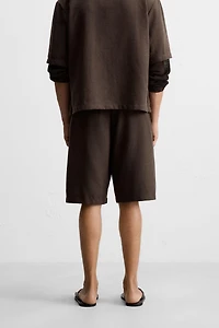TEXTURED PLEATED SHORTS