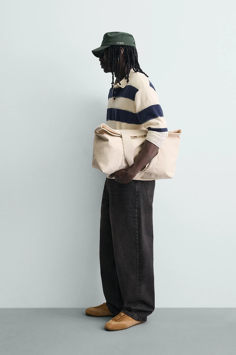 IRREGULAR STRIPED KNIT POLO SHIRT