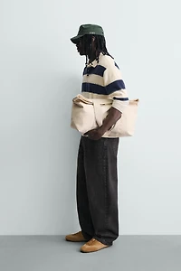 IRREGULAR STRIPED KNIT POLO SHIRT