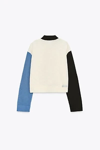 GILET EN MAILLE CONTRASTANT