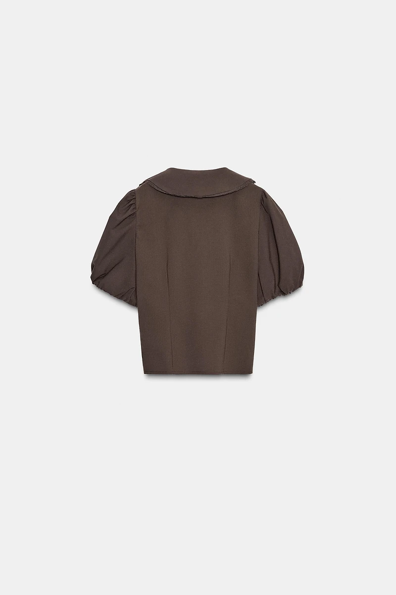 HAUT À COL CLAUDINE ET MANCHES BOUFFANTES