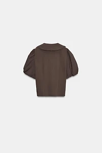 HAUT À COL CLAUDINE ET MANCHES BOUFFANTES