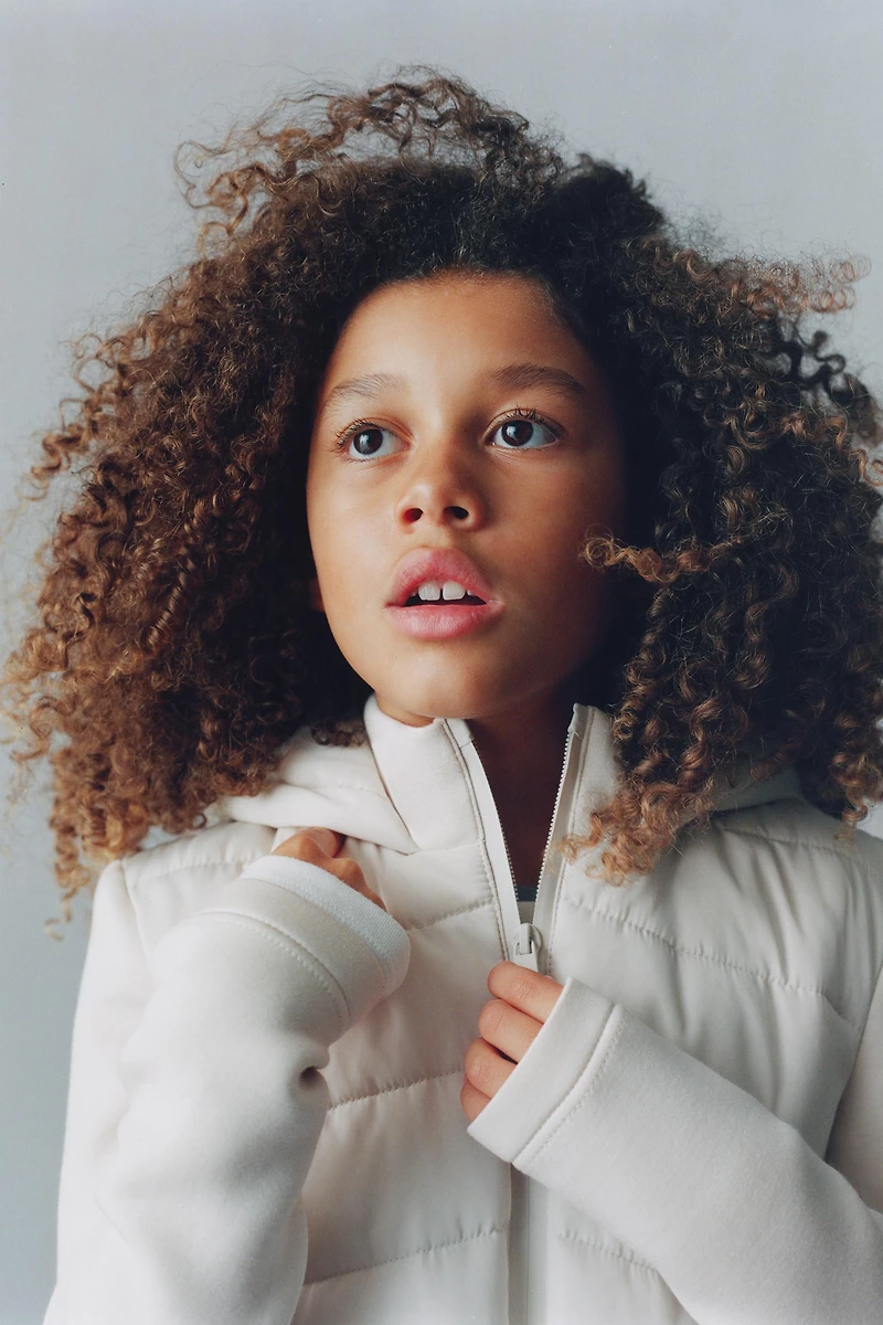 PUFFER JACKET WITH NEOPRENE EFFECT SLEEVES