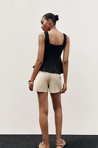 STRETCH PEPLUM VEST TOP