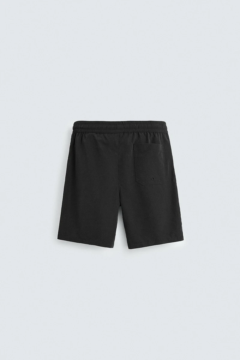BASIC LONG SWIM TRUNKS