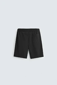 BASIC LONG SWIM TRUNKS