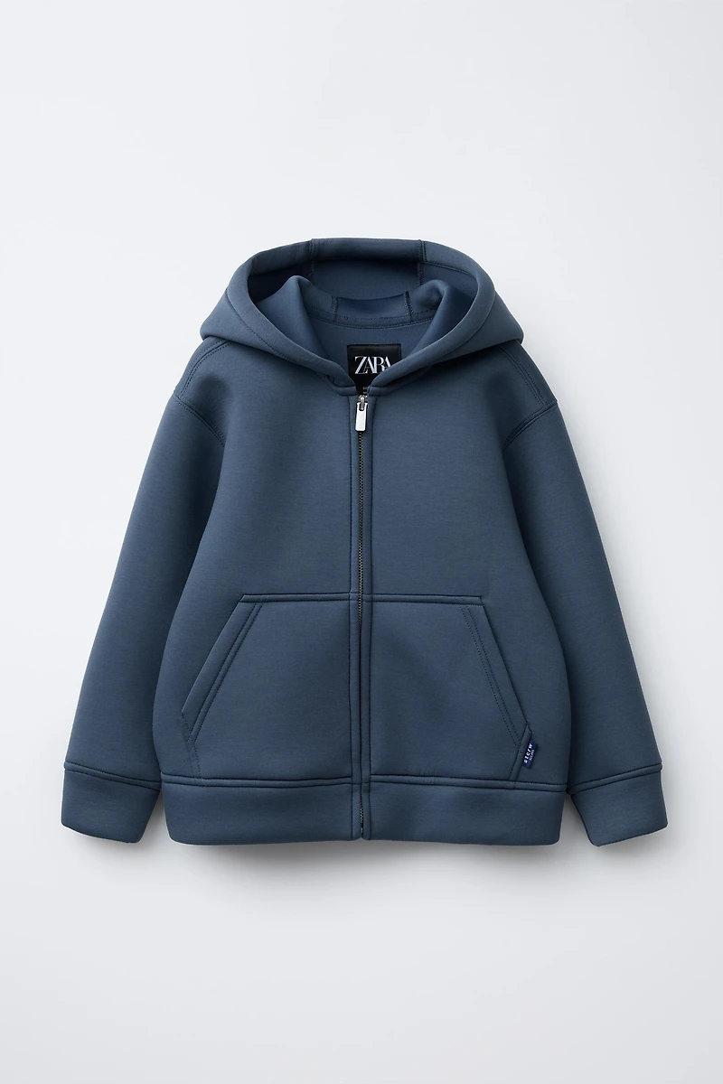 VESTE EFFET NÉOPRÈNE ÉTIQUETTE