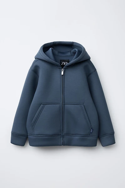 VESTE EFFET NÉOPRÈNE ÉTIQUETTE