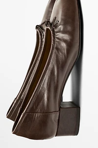 Heeled ballet flat
