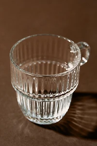 GLASS CUP WITH RAISED DESIGN
